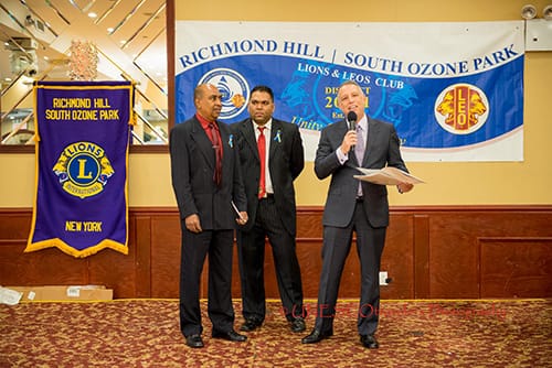 Todd D. Greenberg Esq, presenting New York State Senate Citation to members of the Richmond Hill-S Ozone Park Lions Club